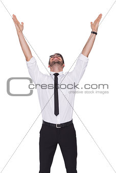 Smiling businessman cheering with his hands up
