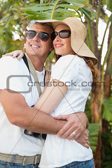 Holidaying couple hugging and smiling