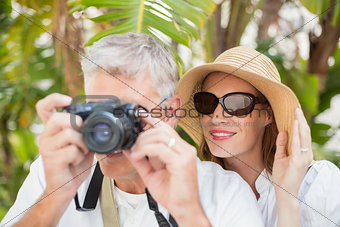 Holidaying couple taking a photo