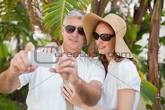 Holidaying couple taking a selfie