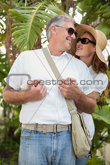 Holidaying couple smiling at each other