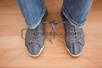 Casual mans shoelaces tied together