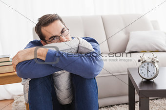 Depressed young man looking at camera
