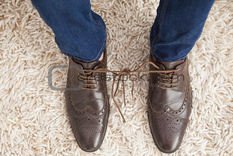 Classy mans shoelaces tied together