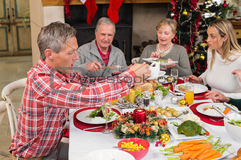 Three generation family having christmas dinner together