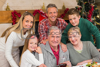 Happy extended family posing at christmas time