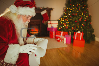 Santa claus reading his list