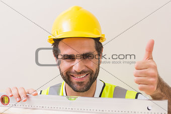Construction worker using spirit level
