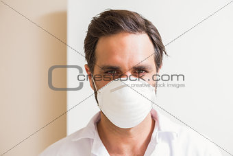 Carpenter wearing protective mask looking at camera