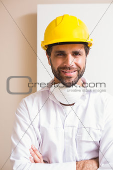 Carpenter wearing protective mask smiling at camera