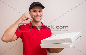 Pizza delivery man making phone call gesture