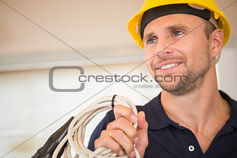 Construction worker posing with cables