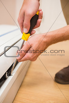 Handyman fixing an air conditioning