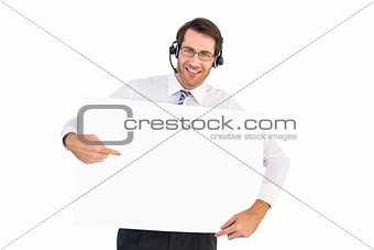 Happy businessman showing card to camera
