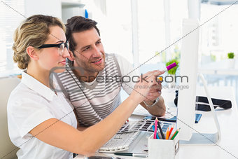 Photo editor pointing with marker on screen