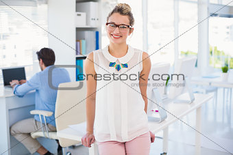 Smiling female photo editor posing