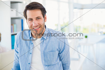 Portrait of handsome smiling photo editor