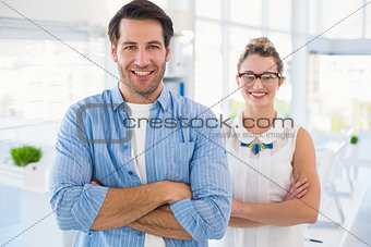 Smilling photo editor posing with arms crossed