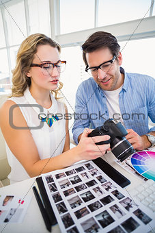 Photo editors looking at camera