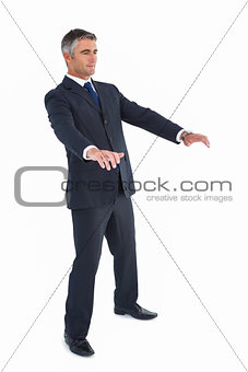 Businessman well dressed with arms out