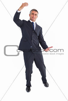 Happy businessman well dressed with arms out