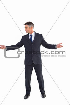 Businessman well dressed spreading his arms