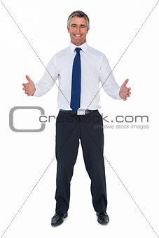 Happy businessman without jacket with arms out