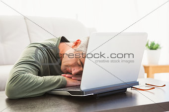 Man sleeping on his laptop