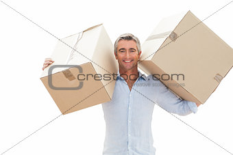 Happy man carrying cardboard boxes