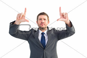 Focused businessman pointing with fingers