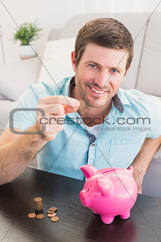 A man showing a pennie