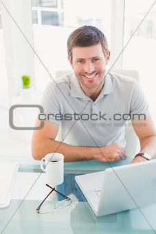 Casual businessman at desk
