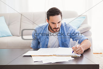 Focused man paying his bills