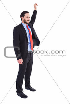 Smiling businessman standing with hand raised