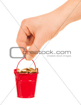 Bucket of money in hand on a white background