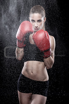 Beautiful woman wearing boxing gloves