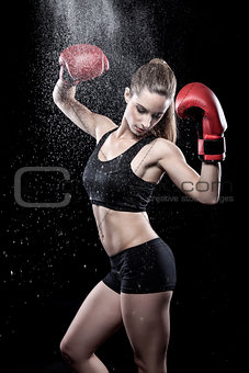 Beautiful woman wearing boxing gloves