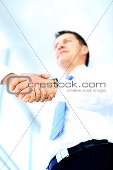 Low angle-shot of shake hands