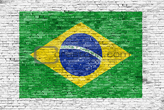 Flag of Brazil painted on white brick wall