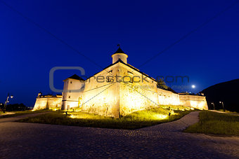 Old fortress "Cetatuia" illuminated at night, Brasov