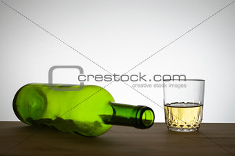 Wine bottle and a glass of wine on a table