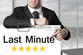 businessman pointing on sign last minute