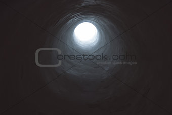 Dark tunnel leading into light opening