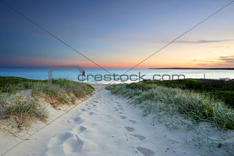 Sandy beach trail at dusk sundown Australia