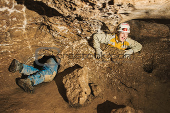 A young girl stuck in cave hole