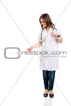 Beautiful young veterinary looking down and pointing, isolated o