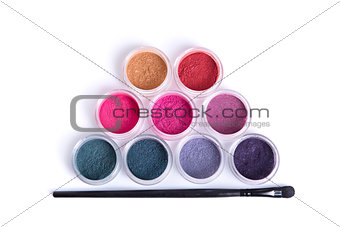 Top view of mineral eye shadows and brush 