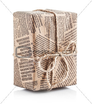 Box packaged newspaper with bow of rope