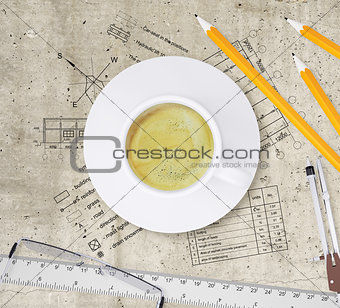 Technical plan of building, pencils, ruler, compasses, eyeglasses and coffee cup