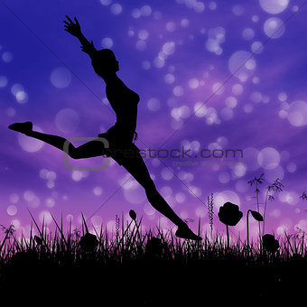 Silhouette of a girl jumping on the meadow